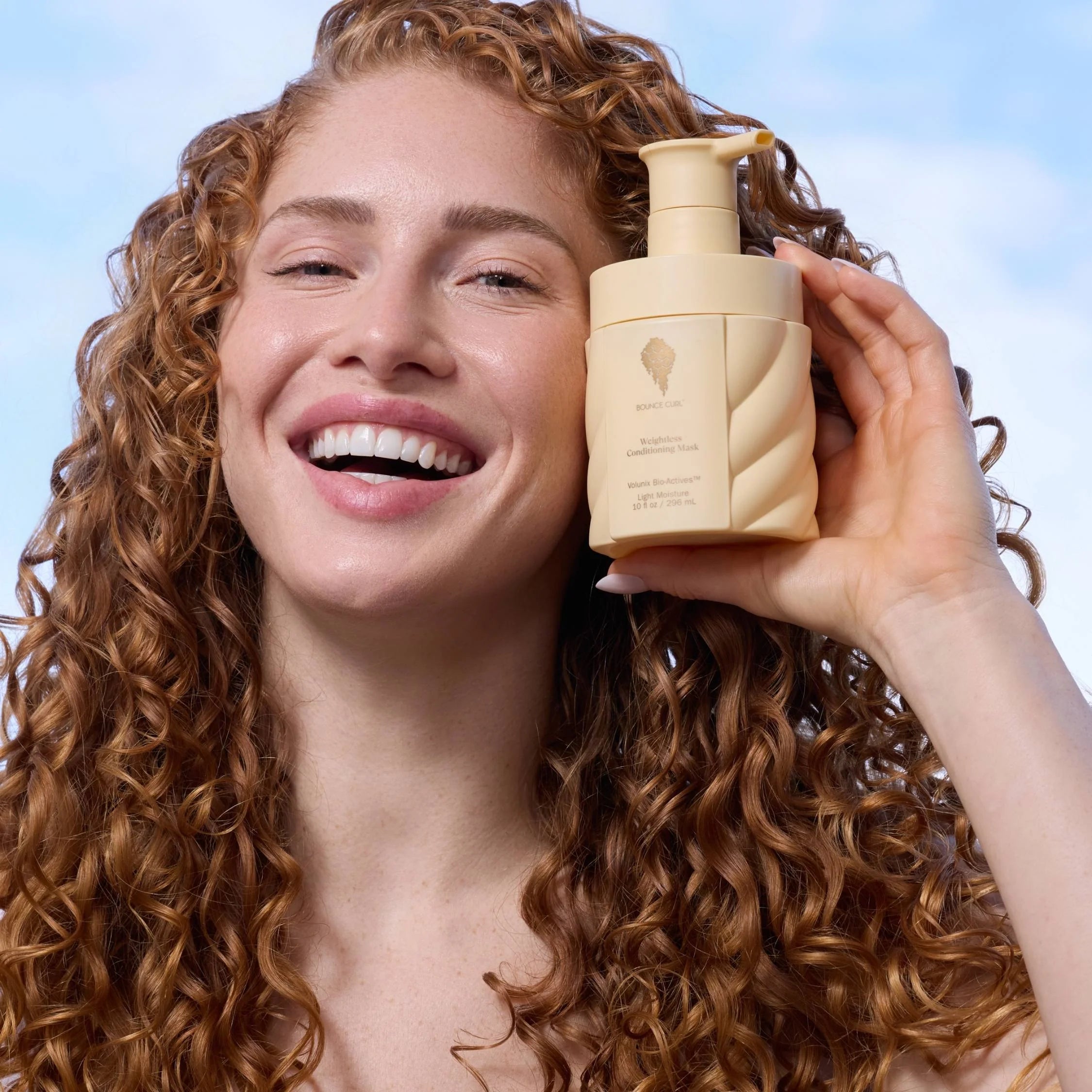 Bounce Curl Weightless Conditioning Mask - model holding product lifestyle shot